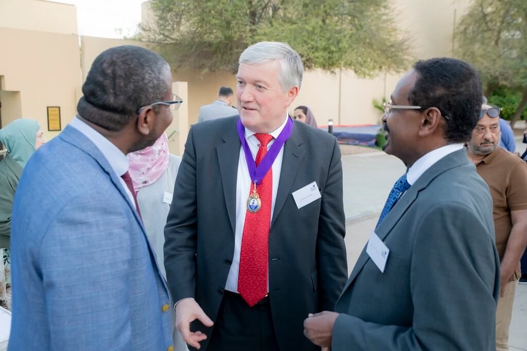 RCPI president chatting with alumni at event in Riyadh